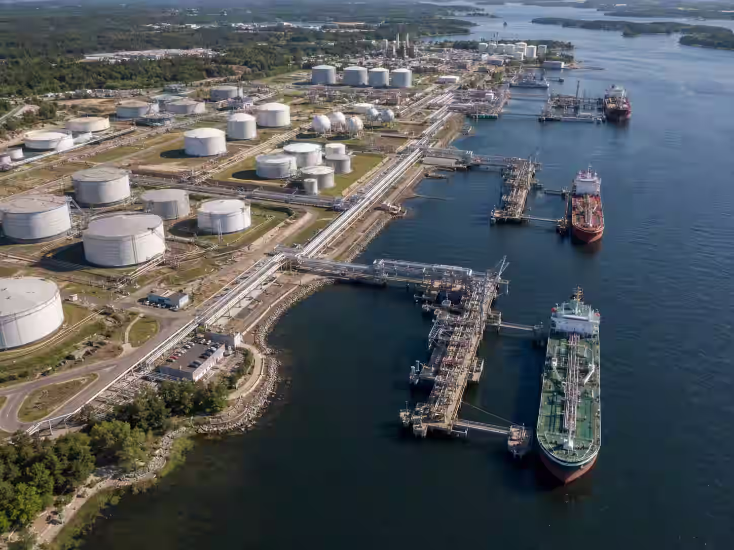 Tanker vessel berthed at marine transfer infrastructure