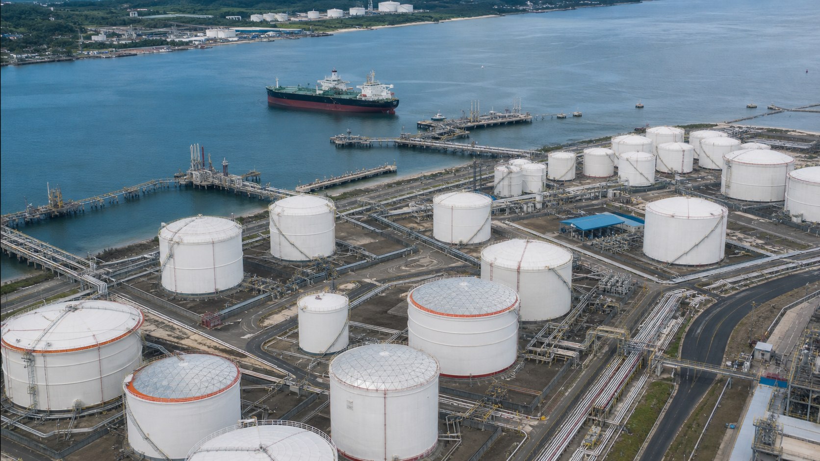 Aerial view of a petroleum storage terminal connected to port and marine infrastructure